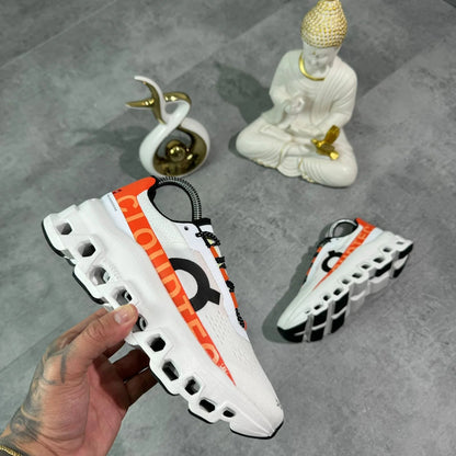 ON RUNNING CLOUDMONSTER BLANCO/NARANJA